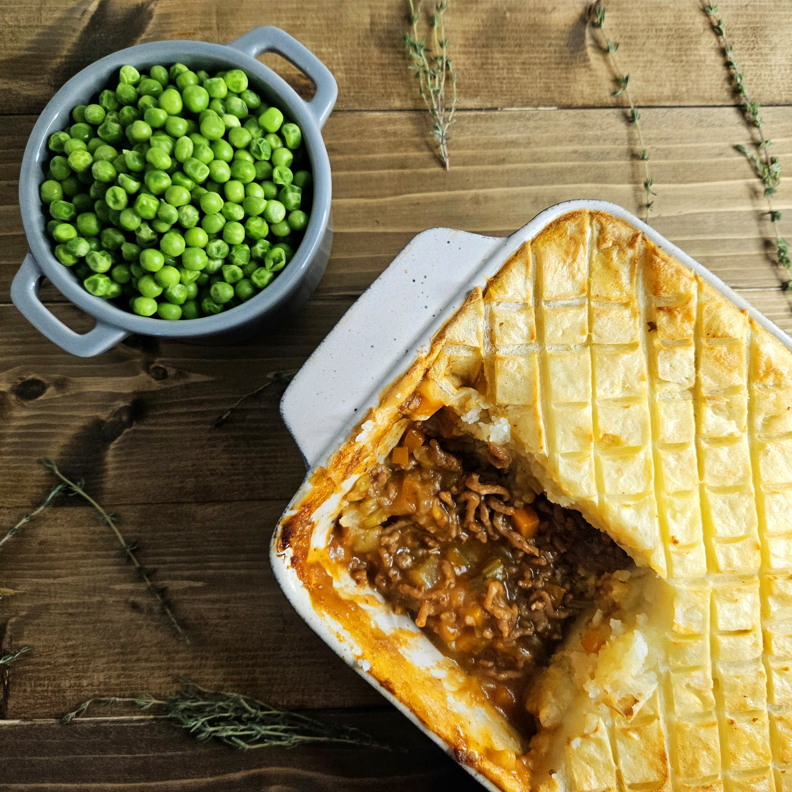 Shepherd's pie, like its cousin, Cottage pie, is a baked dish consisting of a meat filling and a mashed potato topping. There's a closely related French dish known as "Hachis Parmentier."