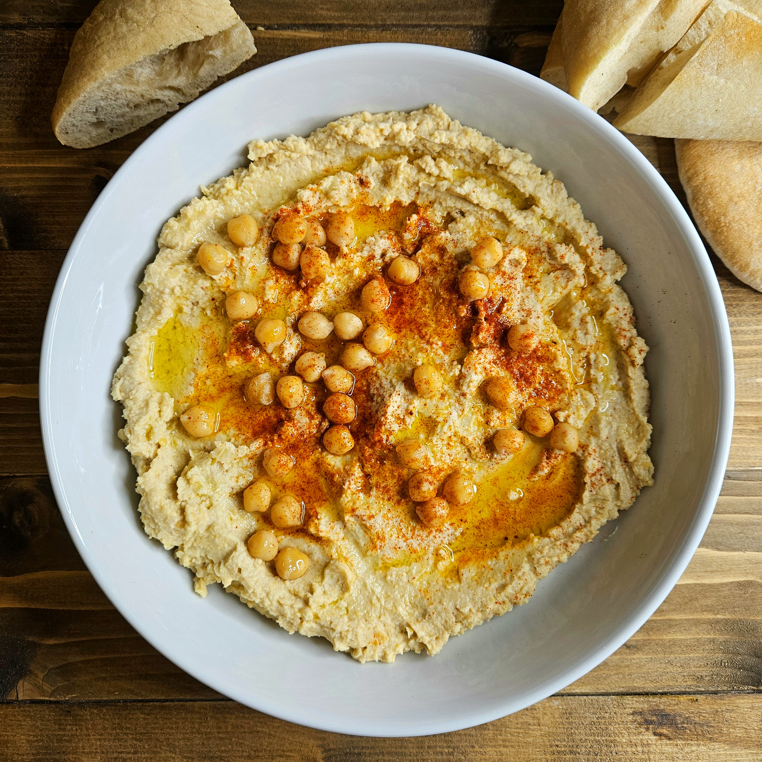 Homemade Hummus with Paprika, Olive Oil and Chickpea Garnish
